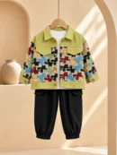 Boy wearing an olive green printed jacket with white T-shirt and black cargo joggers