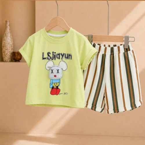 Boy wearing a lime green graphic T-shirt and striped knee-length shorts